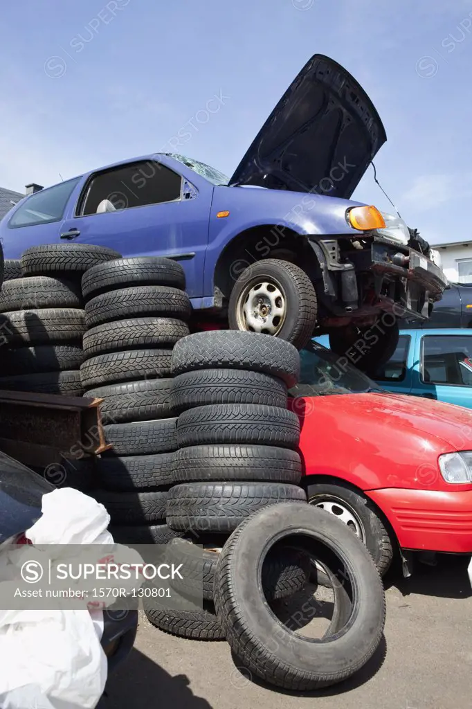 Cars and tires in a junkyard