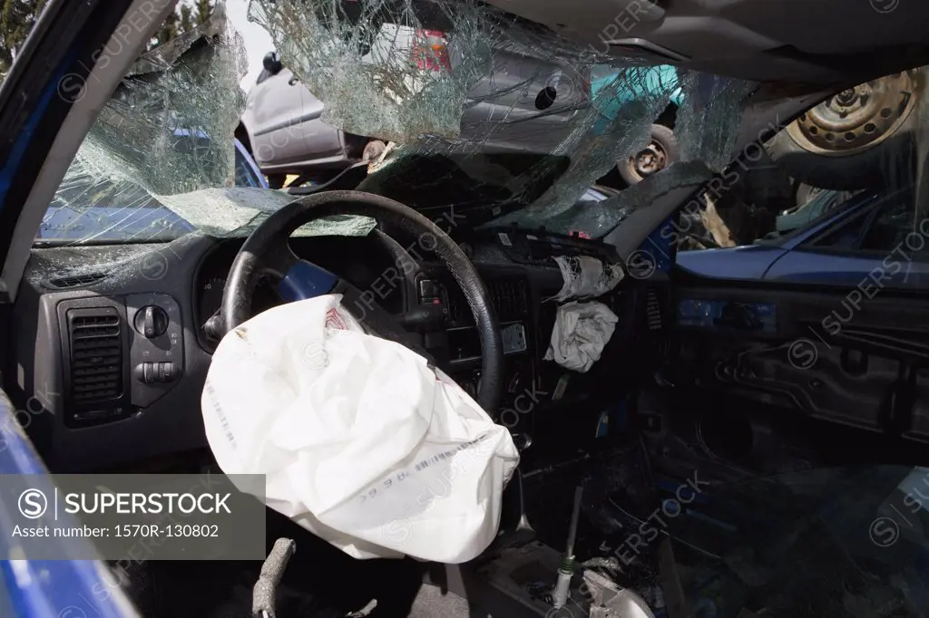 Inside of a car in a junkyard