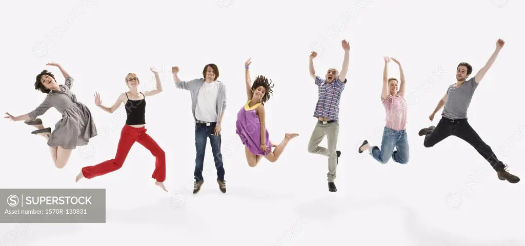 Men and women jumping mid-air together