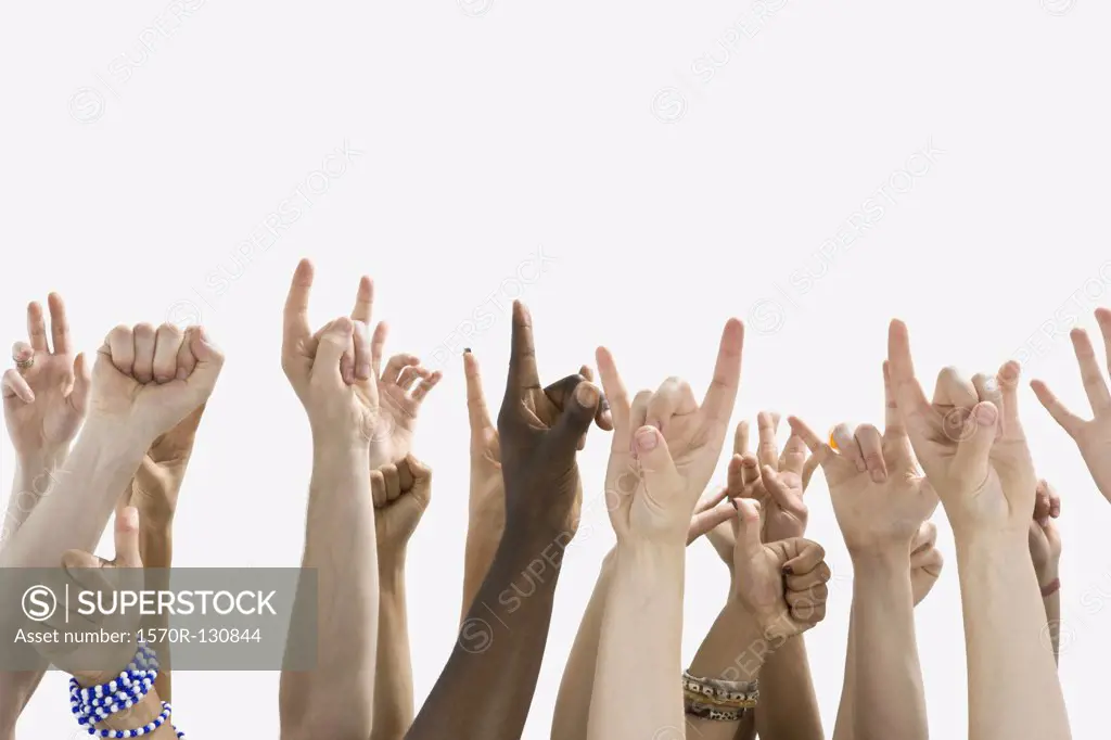 Detail of people with raised hands gesturing