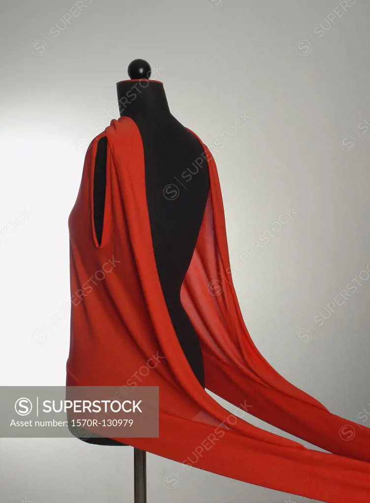 A red garment on a dressmaking model