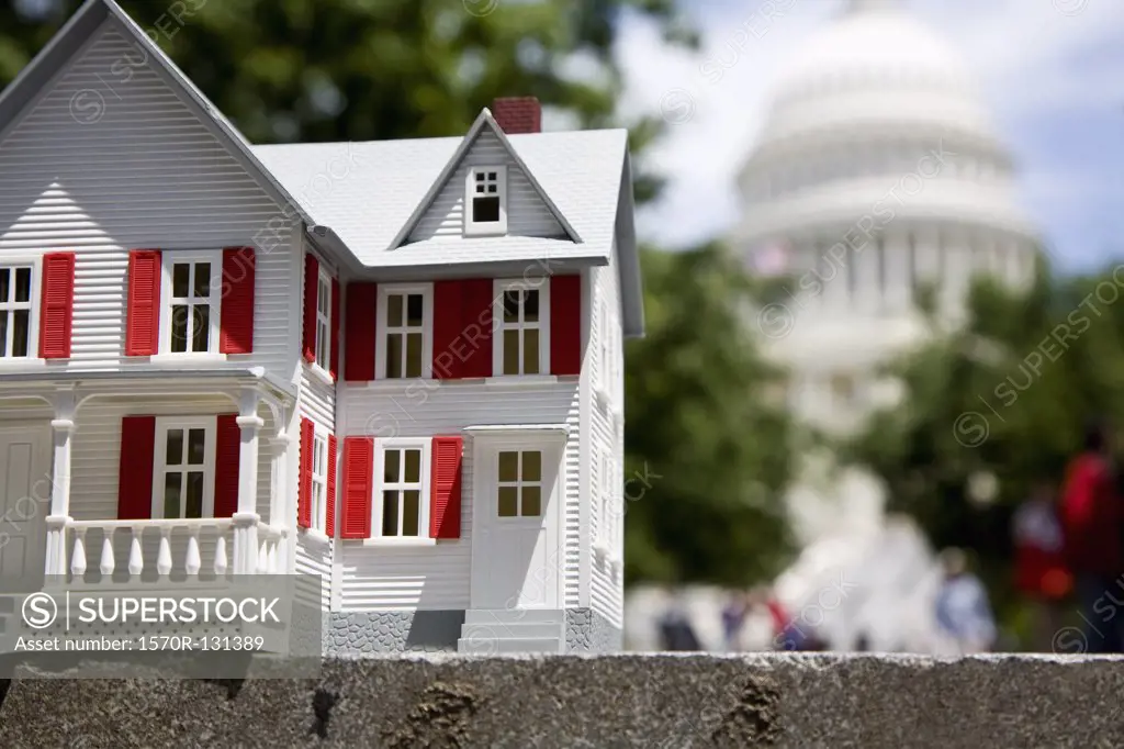Detail of a white model house in front of the United States Capitol Building, Washington DC, USA
