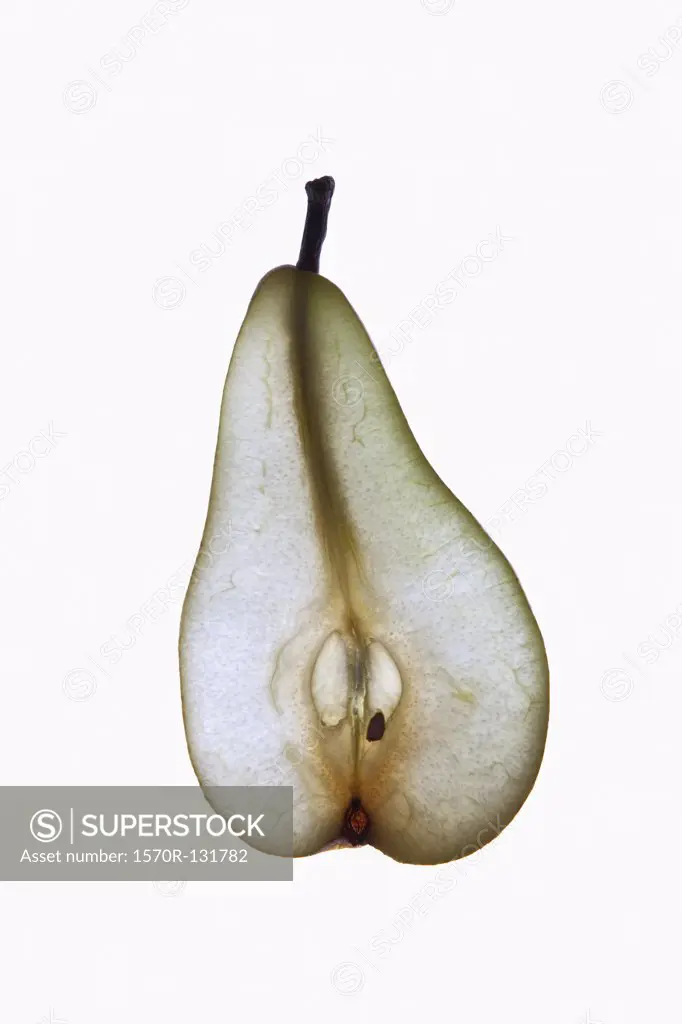 A slice of an organic pear on a lightbox