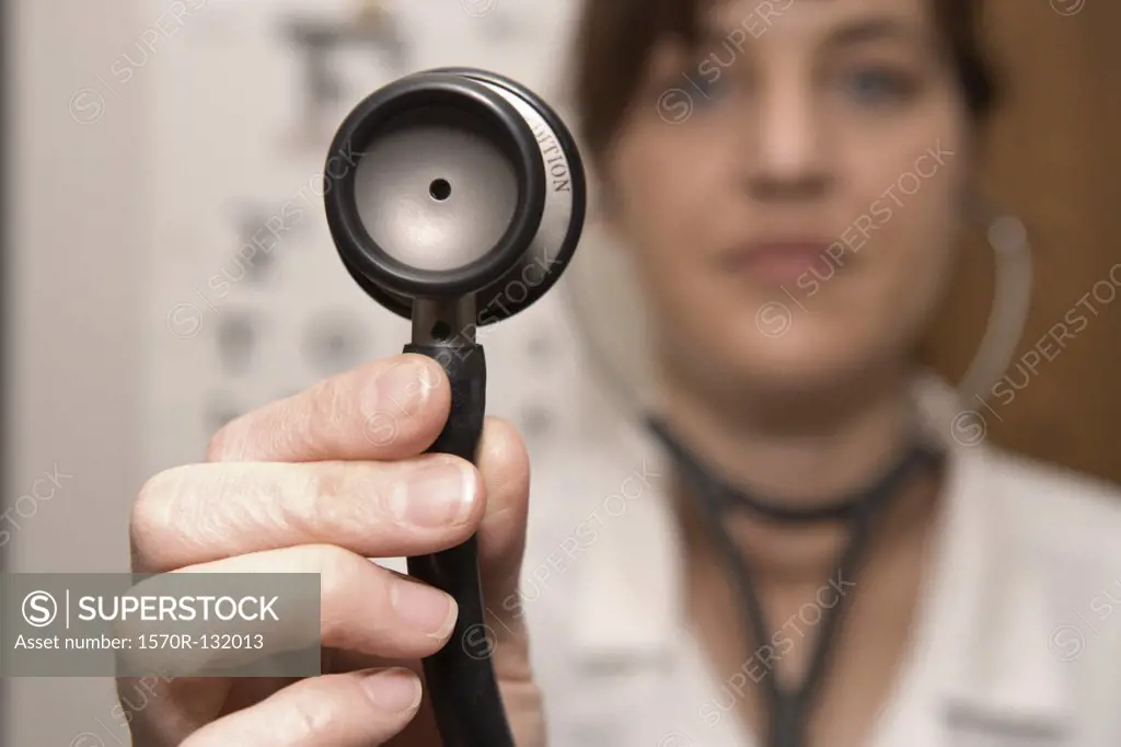 A doctor using a stethoscope