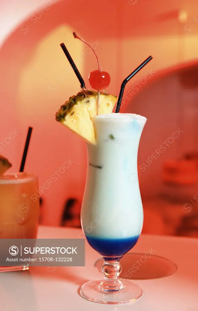 Two cocktails on a bar counter