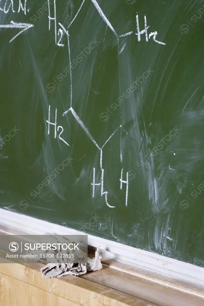 Detail of a handwritten molecular structure on a blackboard