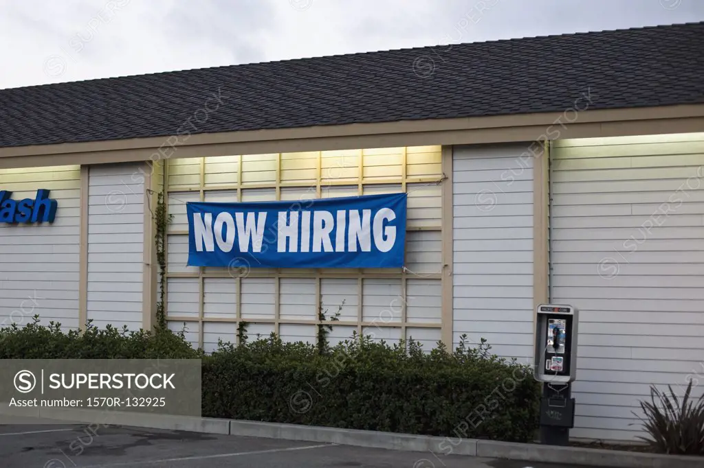 A NOW HIRING sign