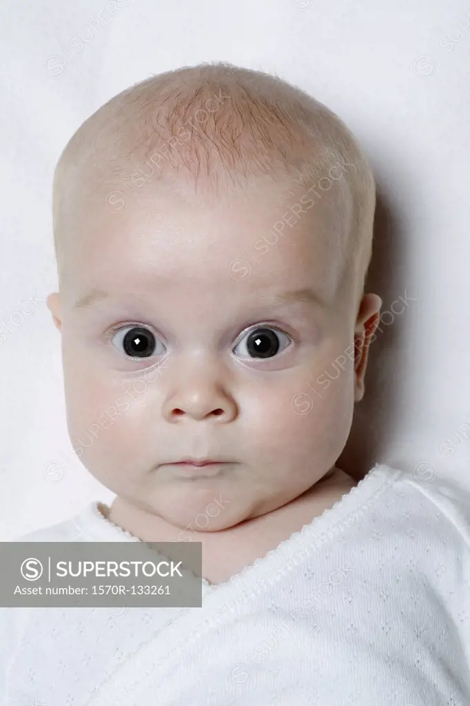 A baby looking surprised, portrait