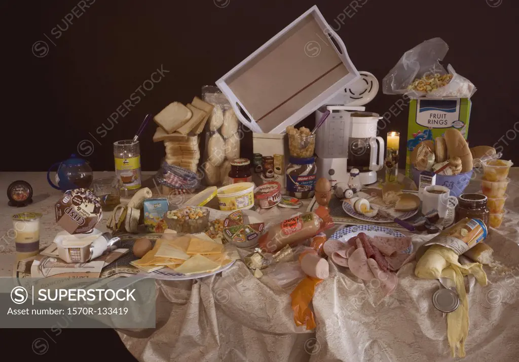 An excess of breakfast foods on a table, still life