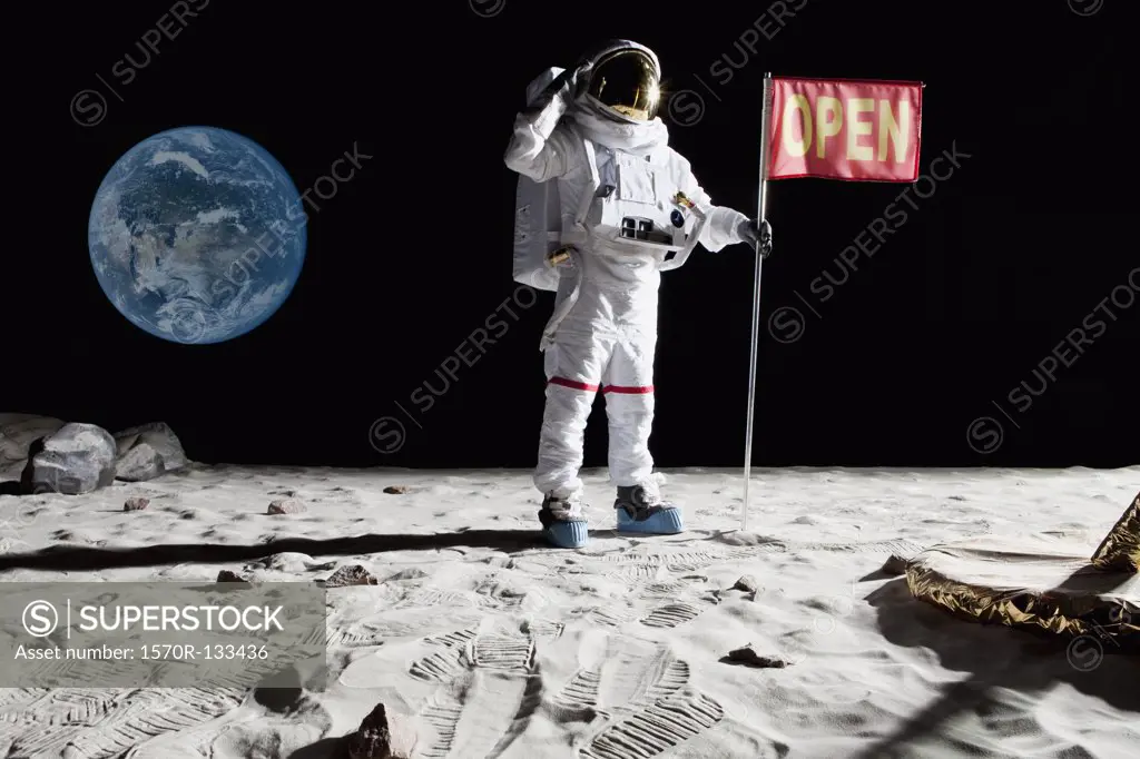 An astronaut on the moon saluting next to a flag with OPEN on it