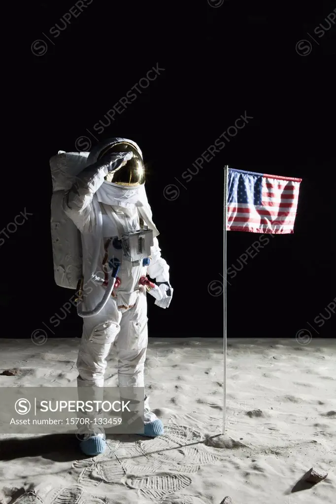 An astronaut on the surface of the moon saluting an American flag