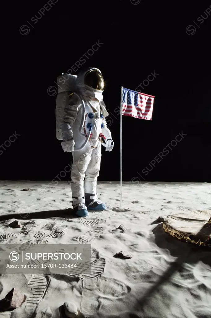 An astronaut on the moon standing next to an American flag