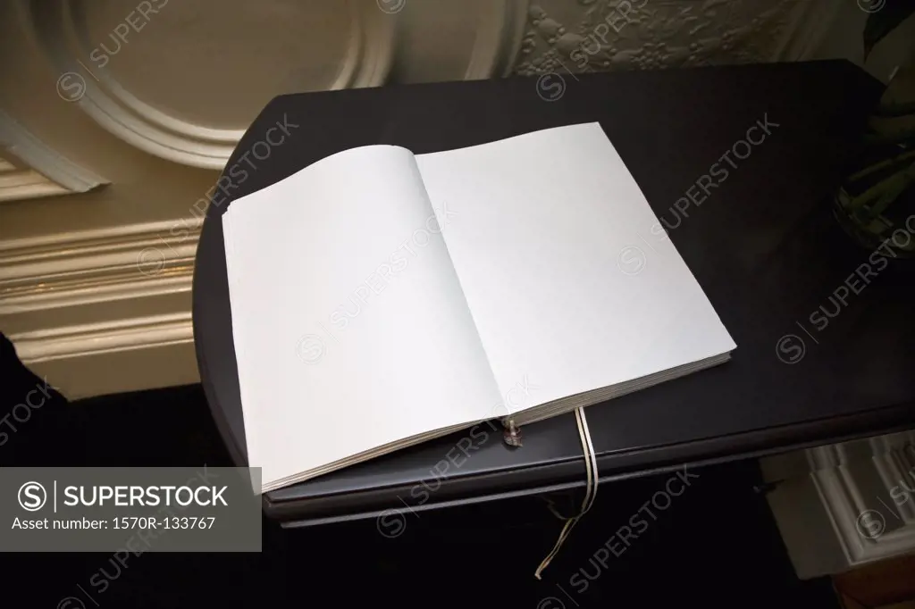 An open blank guest book