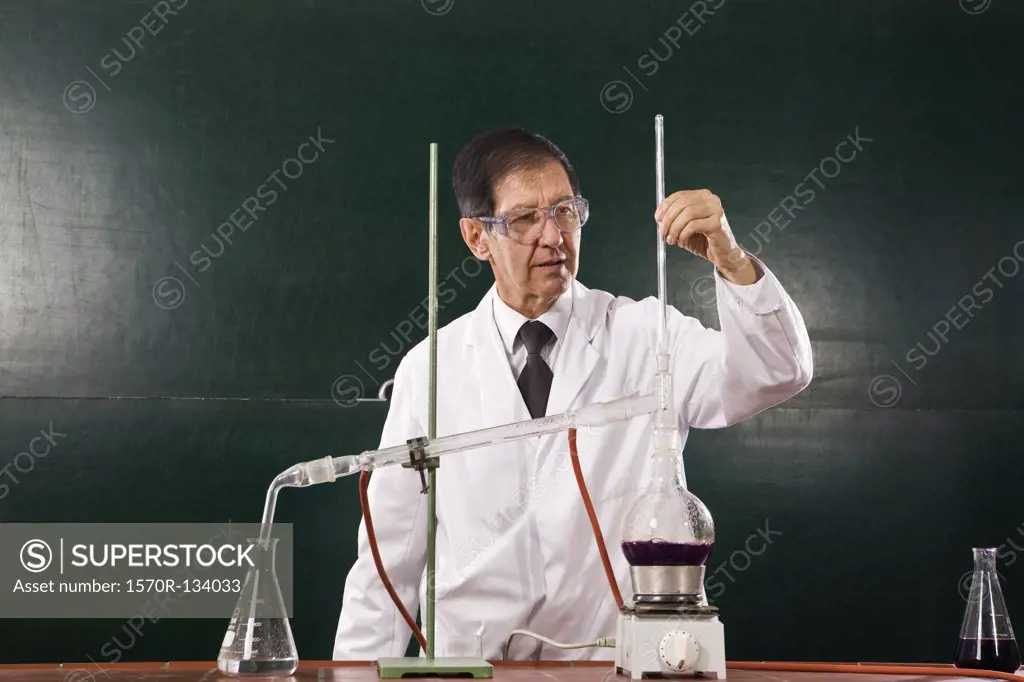 A chemistry teacher conducting an experiment in a classroom
