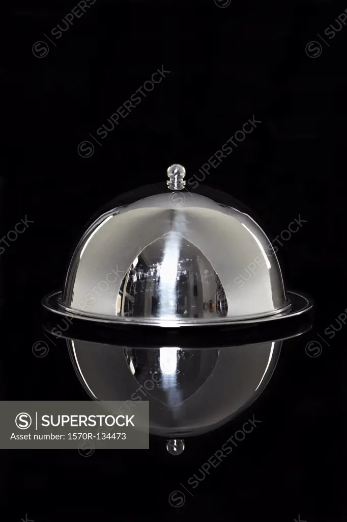 A silver platter with a lid