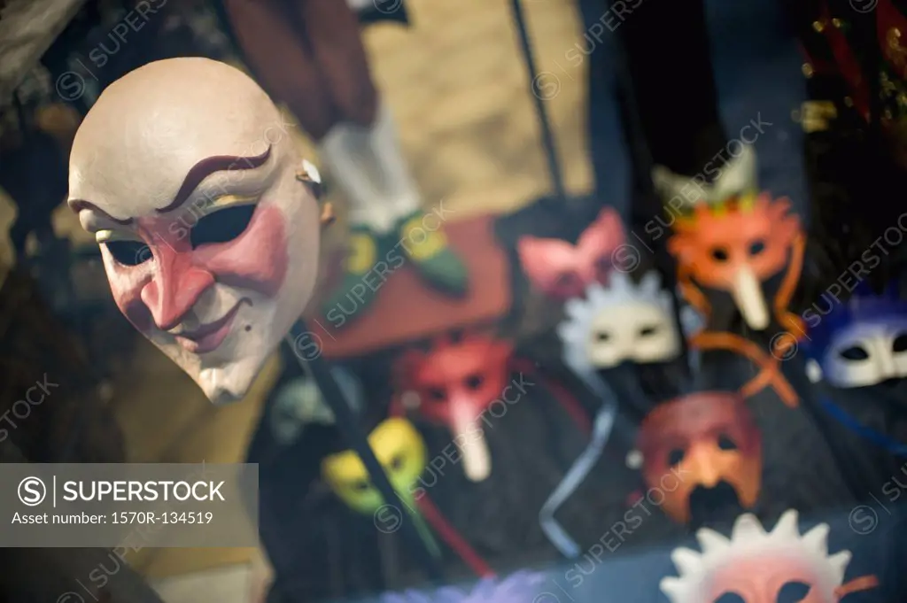 A masquerade mask in a window display
