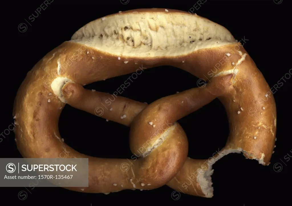A pretzel with a missing bite, directly below