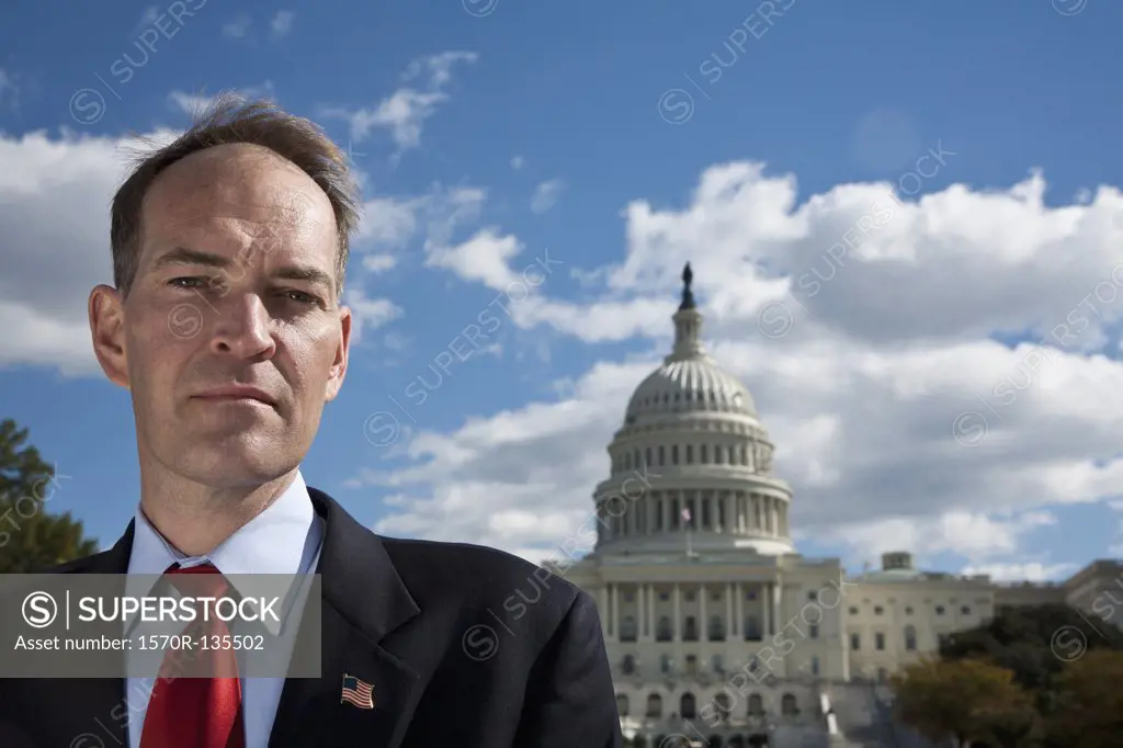 A politician in front of the US Capitol Building