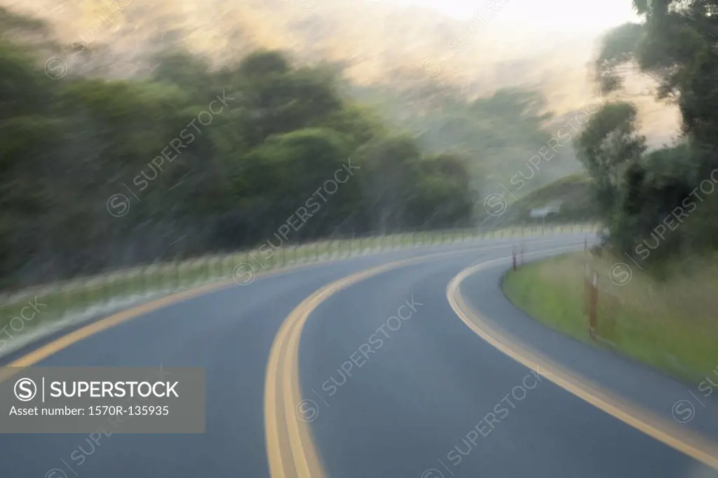 A curve in a highway road, blurred motion