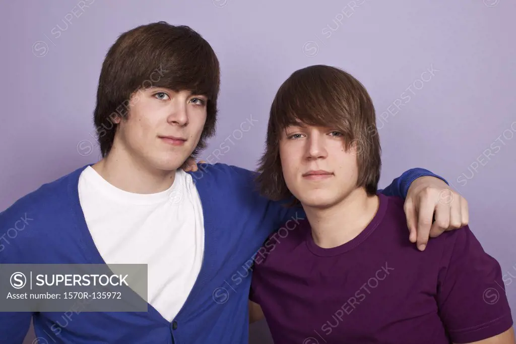 Two teenage boys, portrait, studio shot