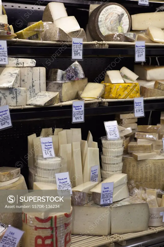 Various cheeses at a market stall