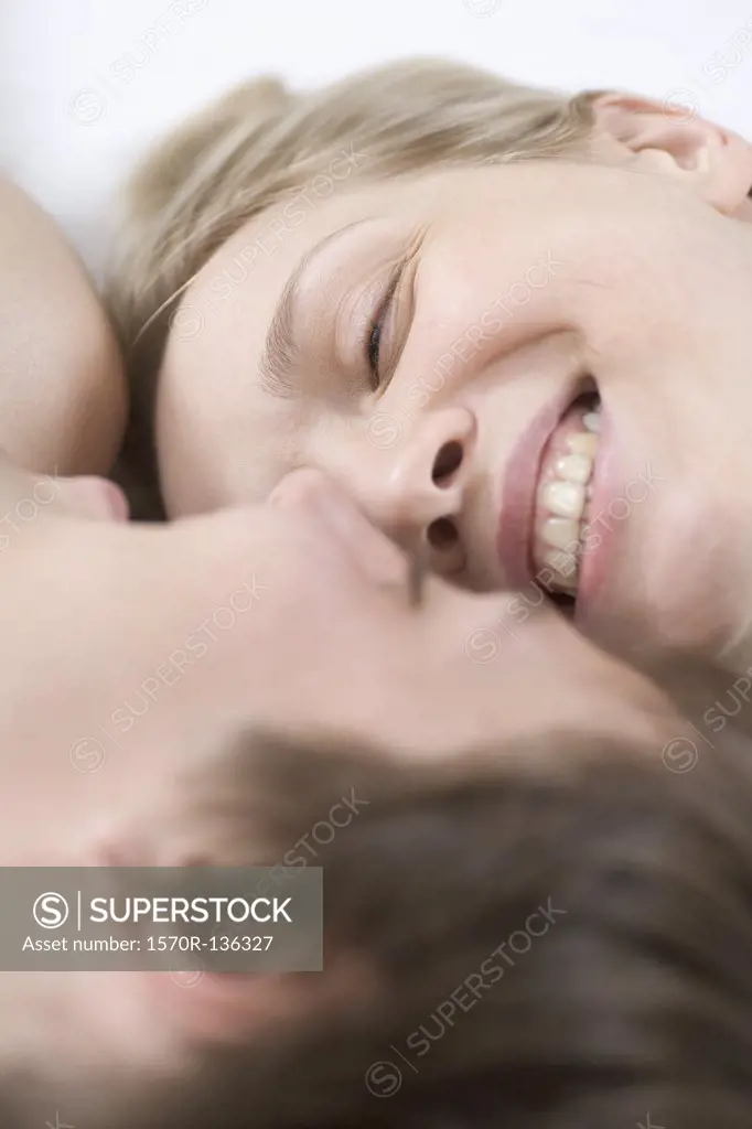 A couple laughing together, close-up