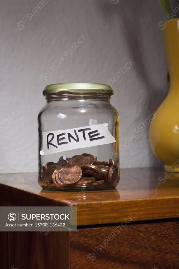 European Union coins in a jar labeled RENTE, the German word for PENSION