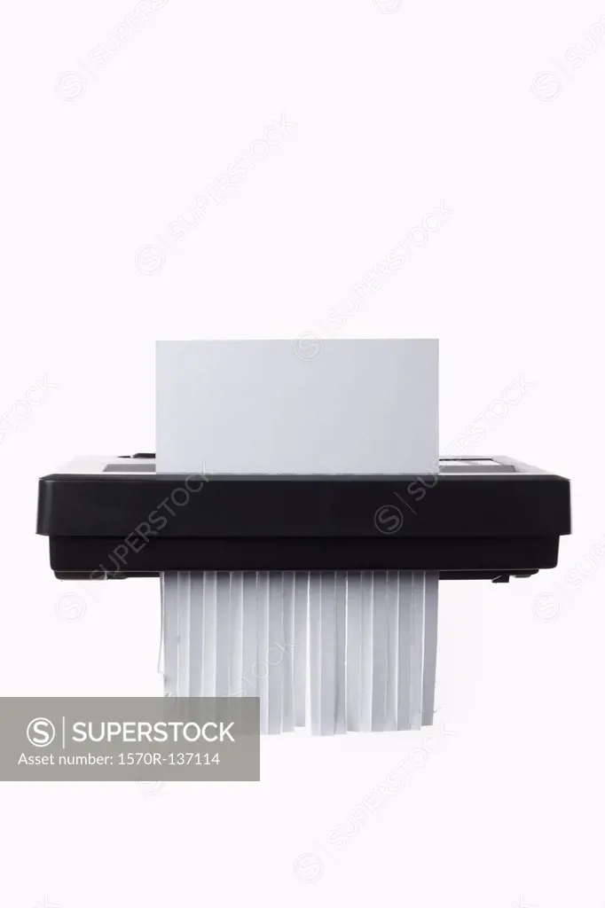 A blank document in a paper shredder