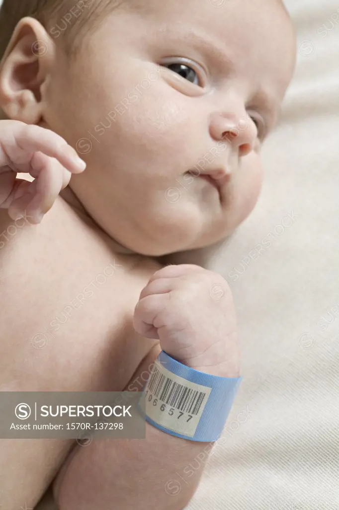 A baby with a hospital ID bracelet