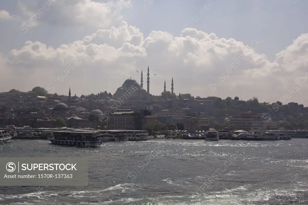 Ferries and tour boats on the Golden Horn River below the Suleymaniye Mosque, Istanbul, Turkey