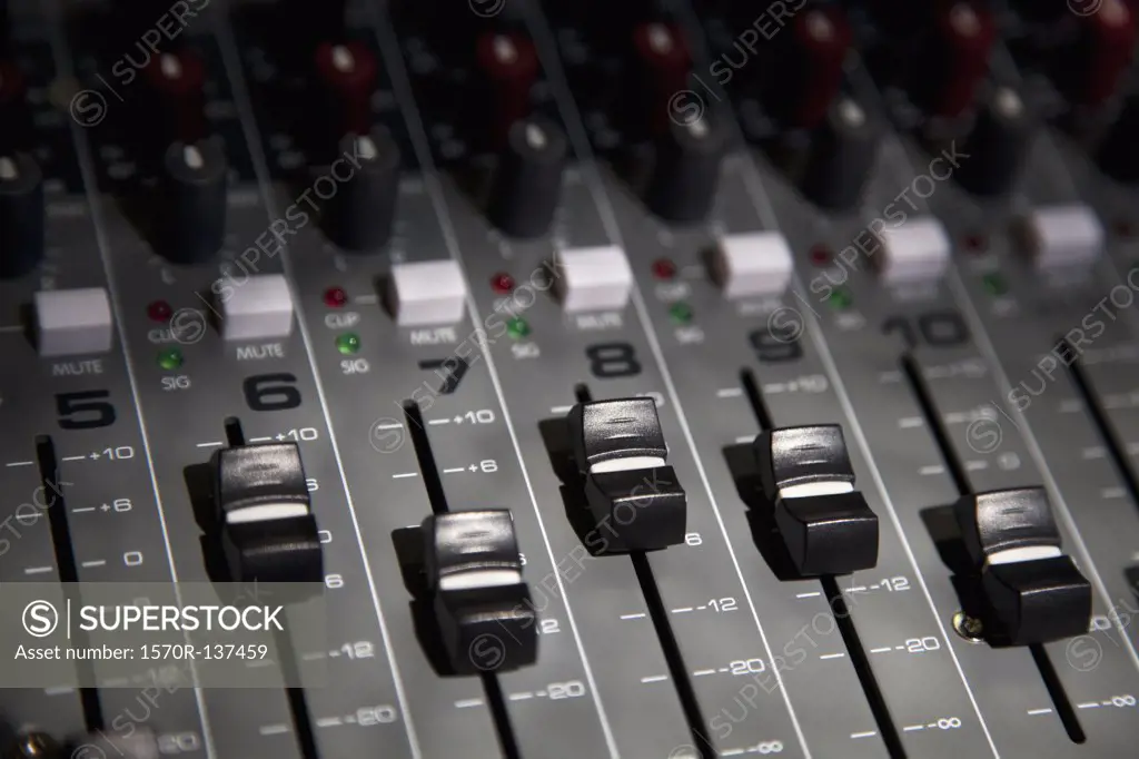 A sound mixing board, close-up, full frame