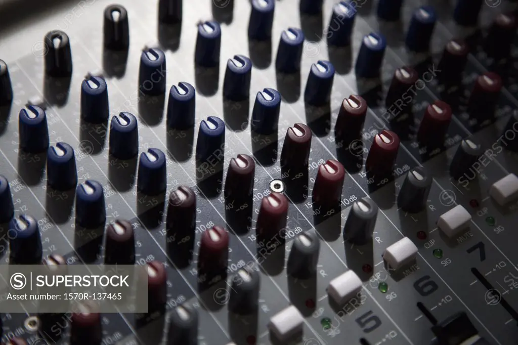 A sound mixing board, close-up, full frame