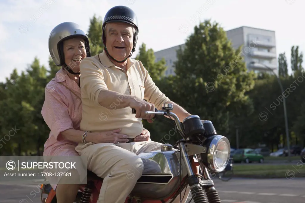 Senior couple on motorbike