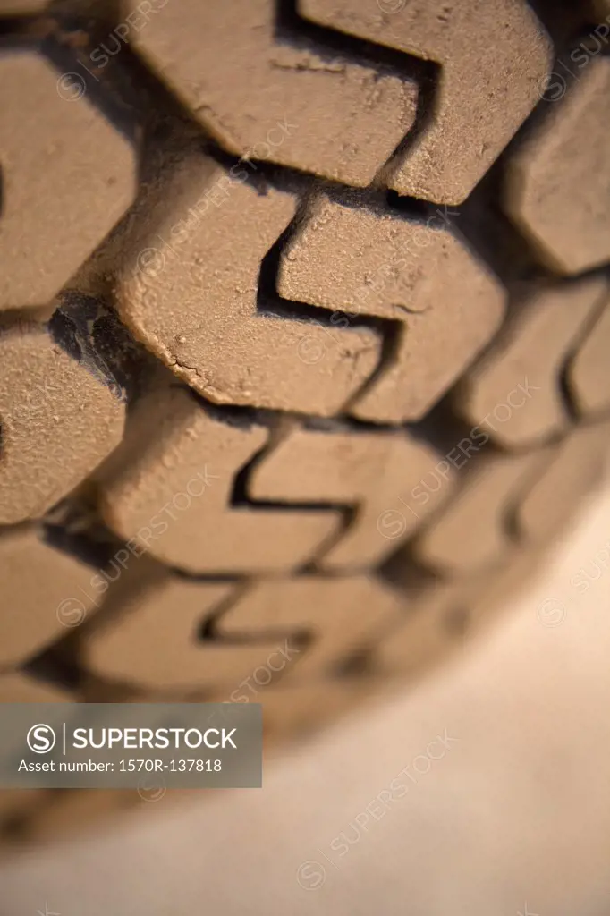 Extreme close up, muddy tire tread