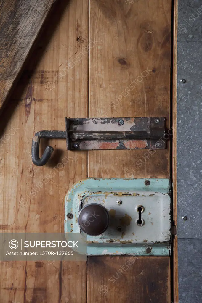 Two old-fashioned locks on a wooden door
