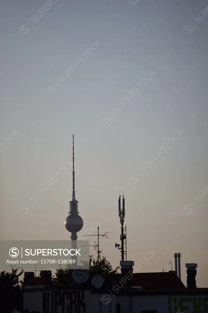 The TV Tower at Alexanderplatz behind a roof with antennas