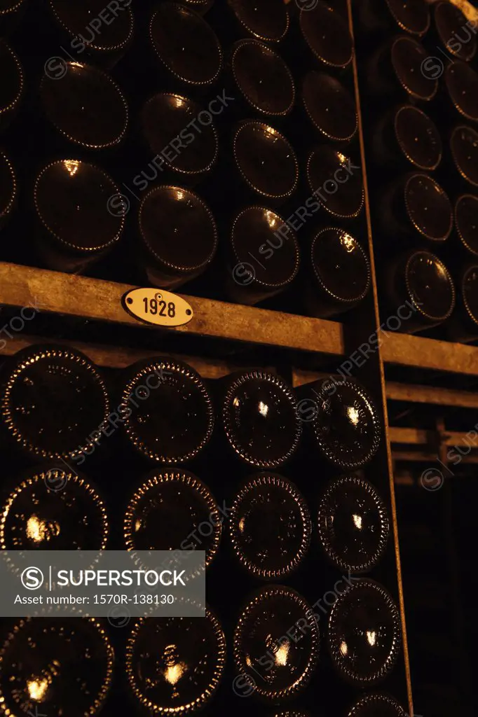 Stack of wine bottles categorized by year