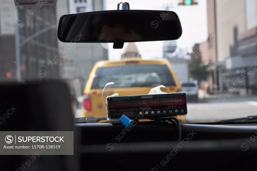The meter in a taxi, seen from the passenger's perspective