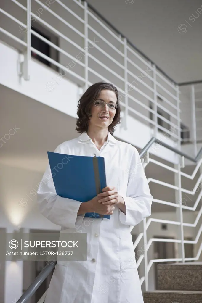 Portrait of a doctor holding a file