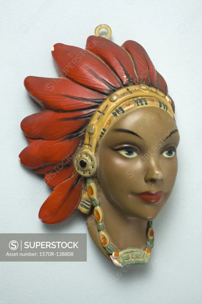 A retro female mannequin wall hanging, Native American motif