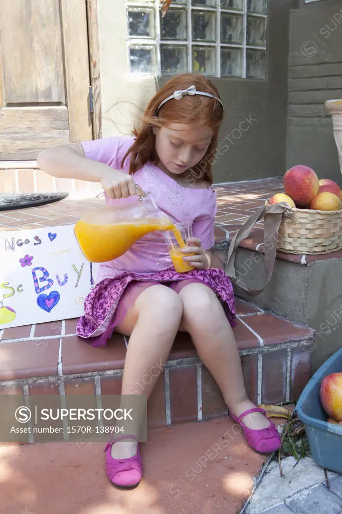 Girl selling apples on front porch and pouring juice from jug