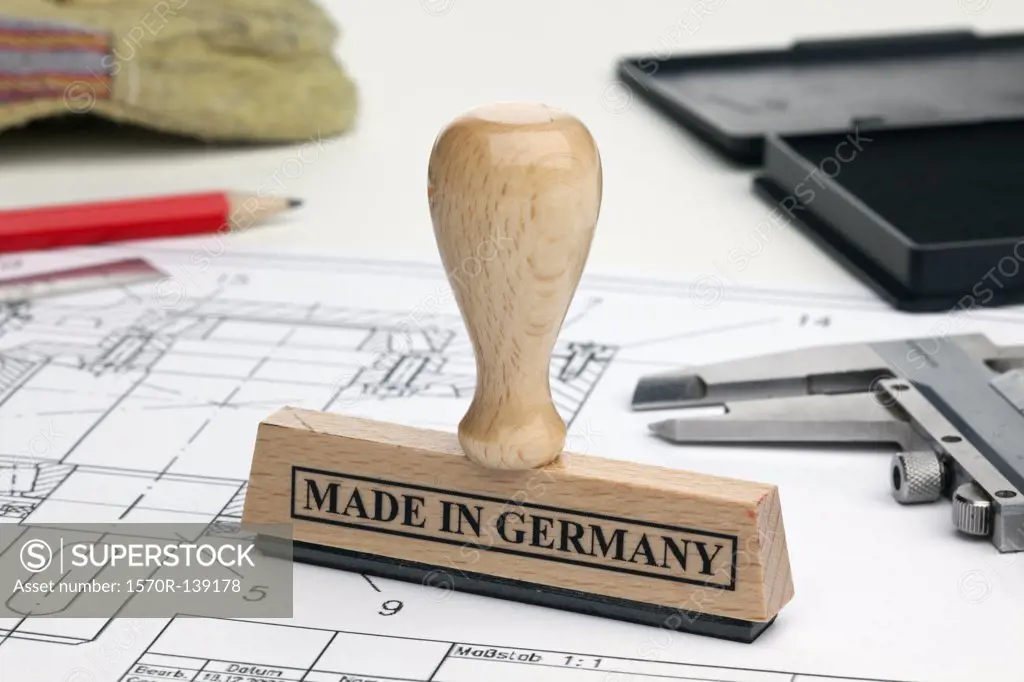 A MADE IN GERMANY rubber stamp on a blueprint