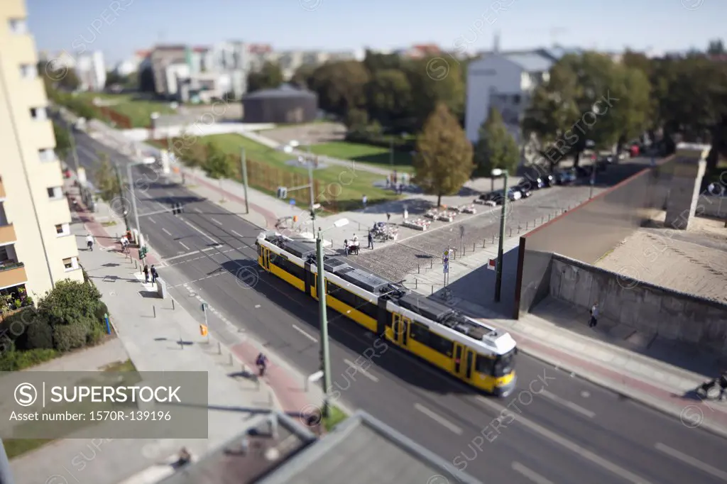 A street scene with a tram, tilt-shift, Berlin, Germany