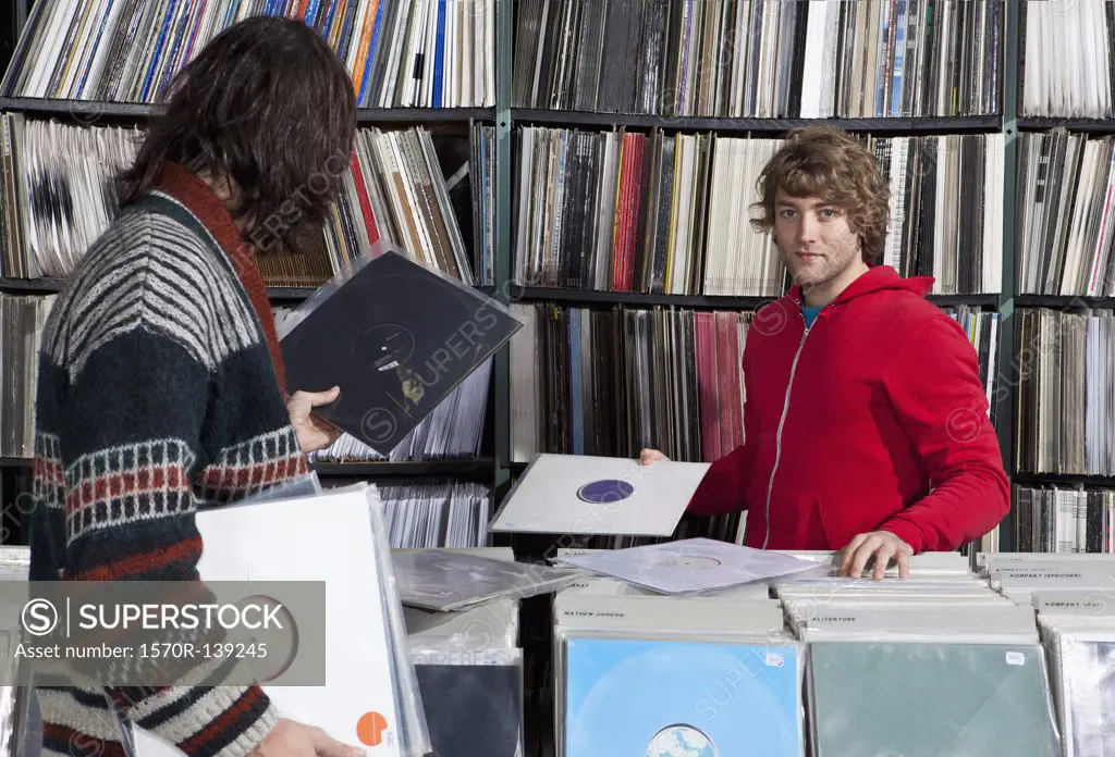 Two men shopping in a record store