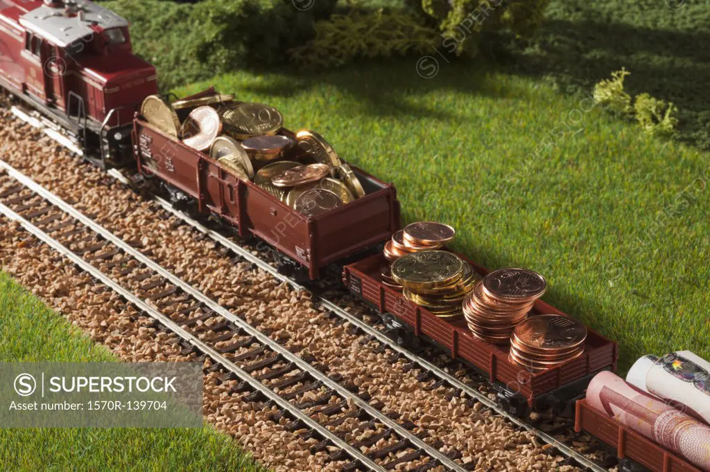 A diorama of a miniature train carrying European Union currency