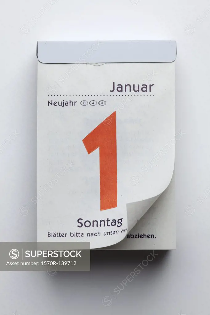 A German daily calendar showing New Year's Day with curled up page corner