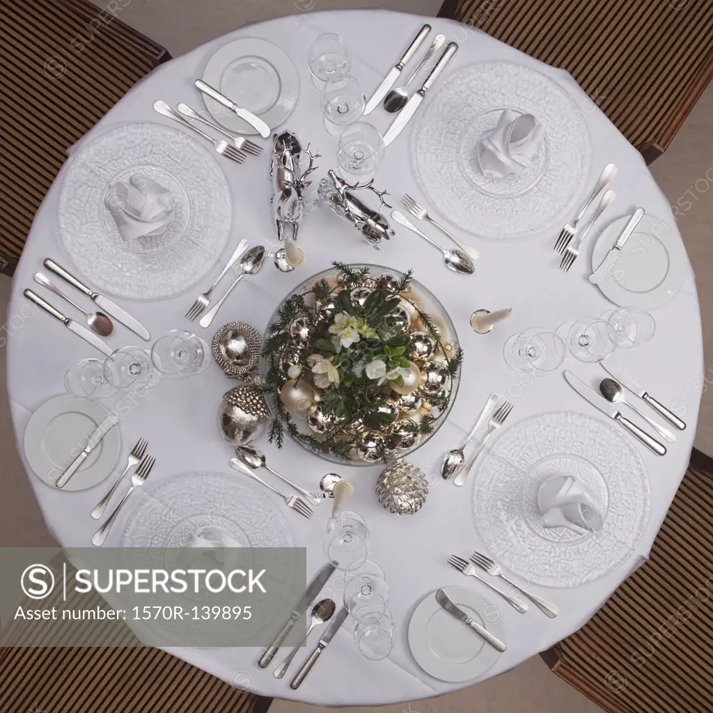 A table set for a formal dinner for four