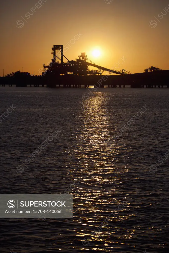 Silhouette of a bucket wheel reclaimer at an iron ore mine