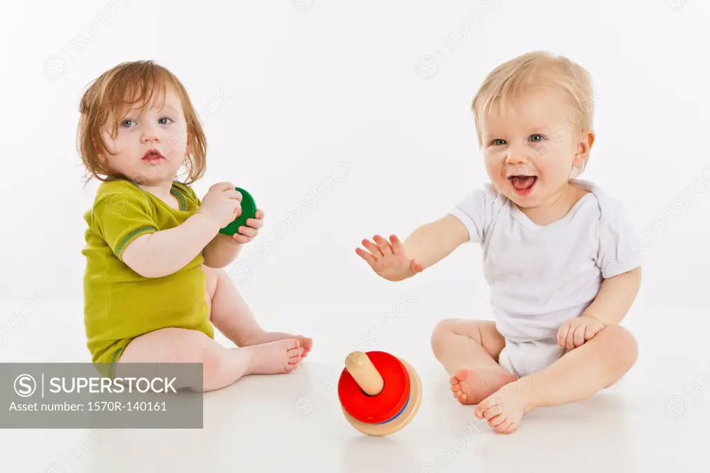 Two babies playing together