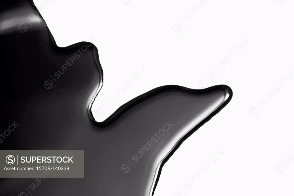 A puddle of black paint, close-up